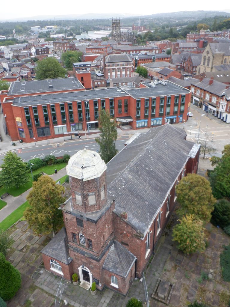 St Peter's Church from 40 metres high showing St. Petersgate, St. Mary's Curch and the glass Market Hall hiding amongst the mainly red brick sea of buildings